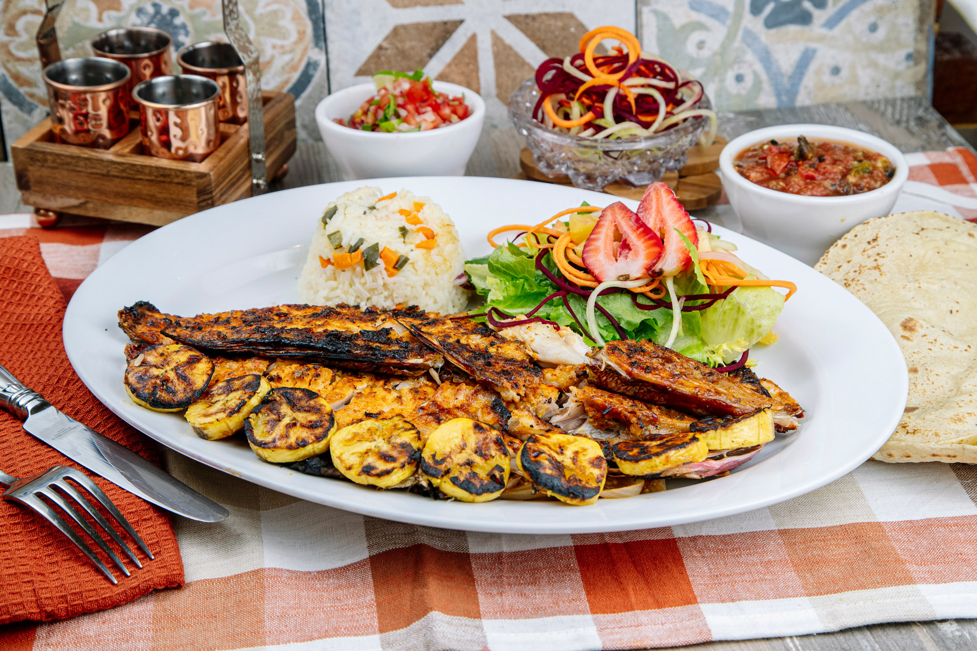 Shared table with fresh dishes